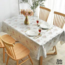 Toile cirée argentée fleurie